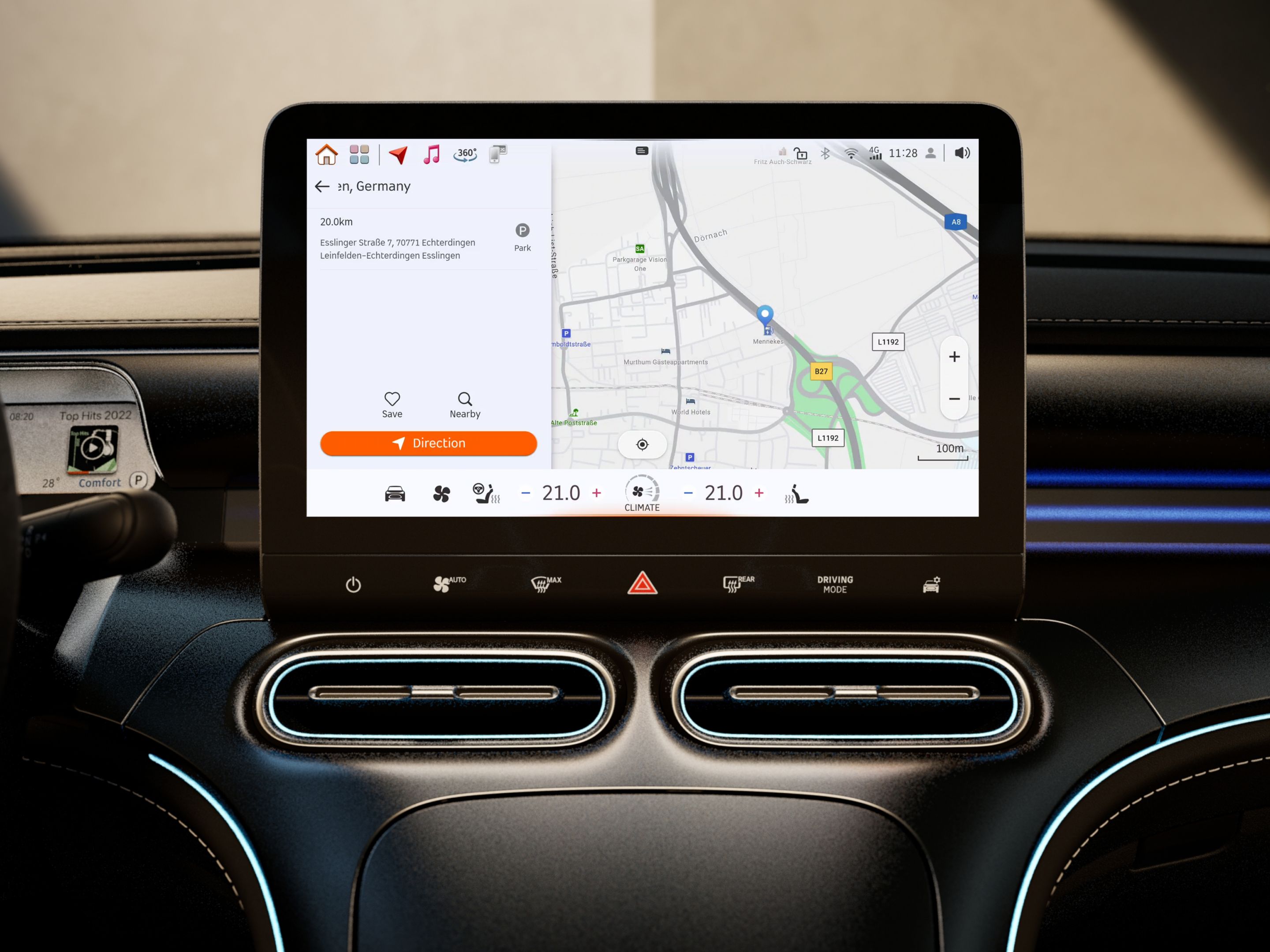 Close-up of the centre display in a smart interior. The interface shows the navigation system with live traffic, media control and weather forecast.